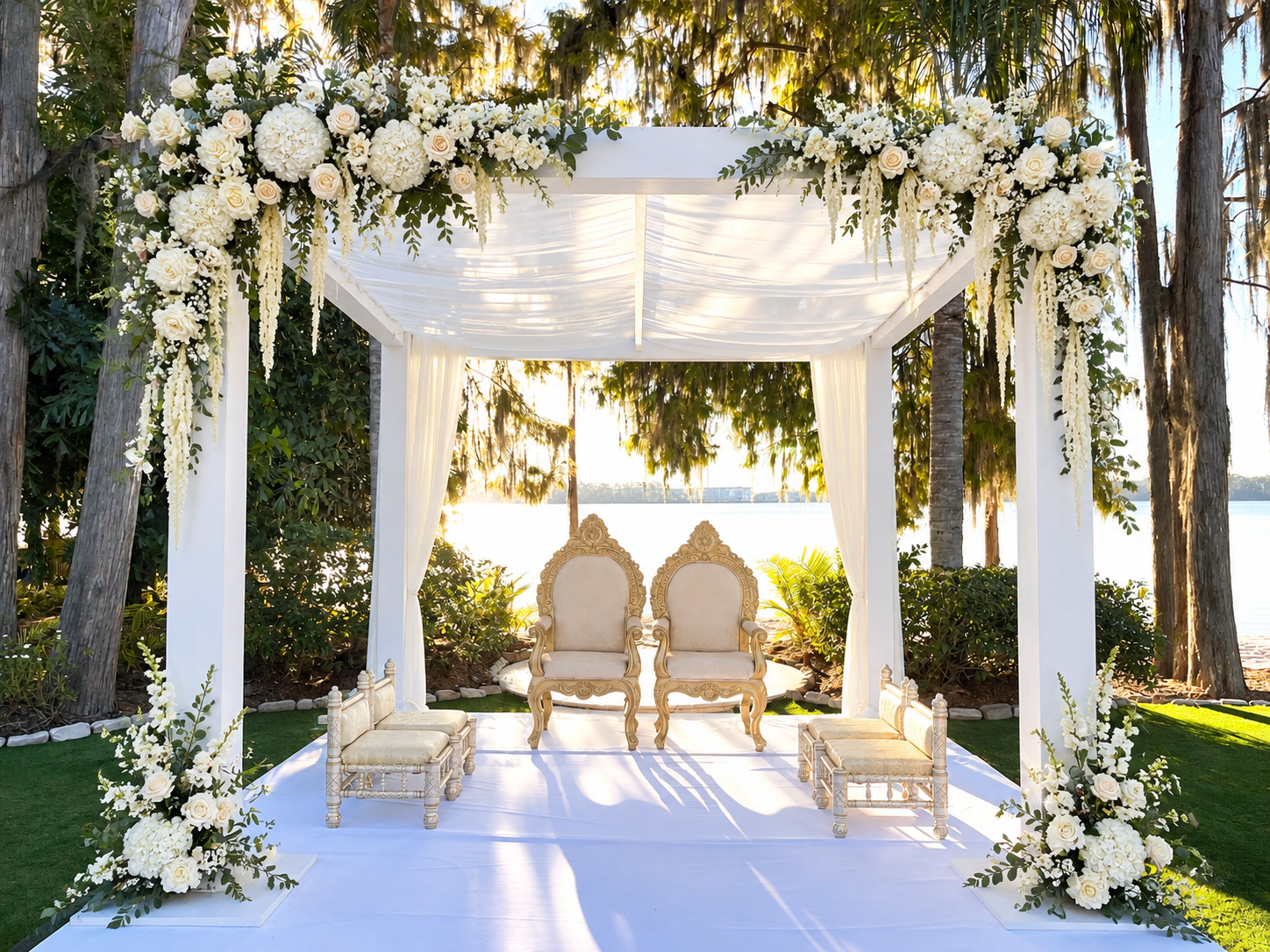All-white lakeside mandap with cascading white florals